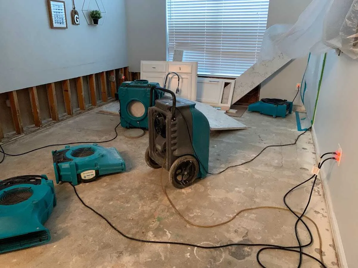 Dehumidifier in flood-cut room for Water Damage Restoration in Long View